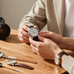 Inspecting premium replica watches with elegant accessories in a stylish setting.